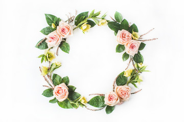 Frame of pink roses, branches, leaves and petals isolated on white background. Flat lay, top view