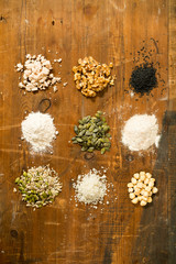 Assortment of Seeds and Baking Ingredients in a Grid