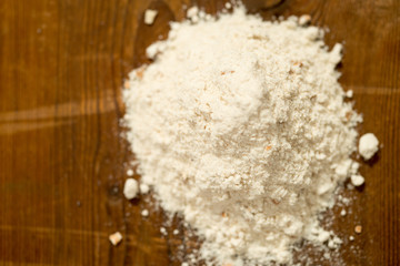 Heap of Wheat Flour on Wooden Surface