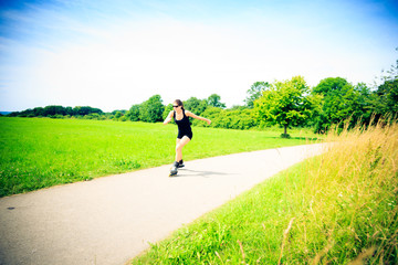 Young Woman With Inline Skates