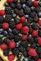Fruit background with raspberries, blueberries and blackberries.