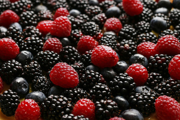 Fruit background with raspberries, blueberries and blackberries.