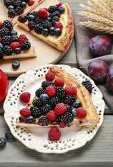 Piece of fruit tart with blackberries, raspberries and blueberri