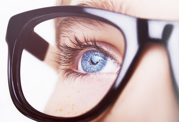 Portrait of a boy wearing glasses close