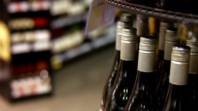 Variety of wine bottles in grocery section at supermarket