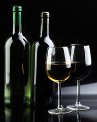 Wine glass and Bottle on black background. Red and white wine