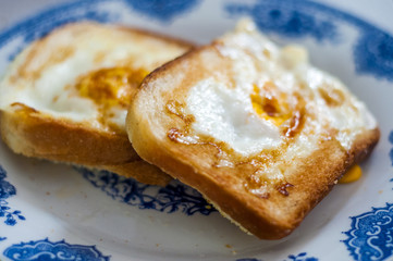  Eggy bread on the plate, photographed with natural light. 