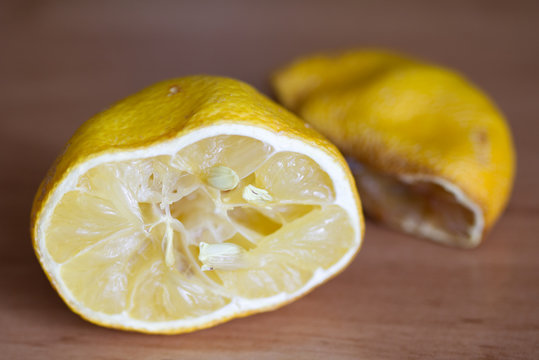 Old Squashed Lemon Fruit On A Wooden Background