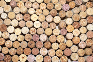 Background of used wine corks. Wall of many different wine corks. Closeup of wine corks.