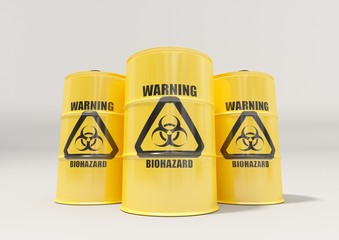 Yellow metal barrels with black biohazard warning sign isolated on white background