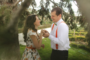 Obraz premium Young couple engagement session, sunny day