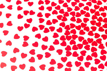 Valentines day pattern of red hearts confetti on white background. Festive Valentine.