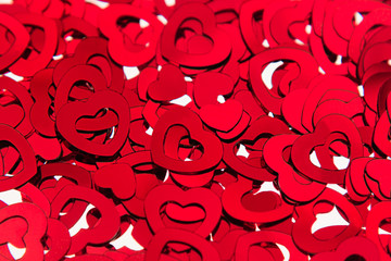 Valentines day background of red hearts confetti. Festive Valentine.