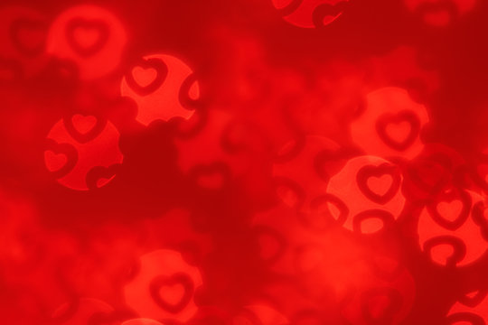  Valentine's day abstract background of soft scarlet red bokeh blur hearts. Festive valentine backdrop.