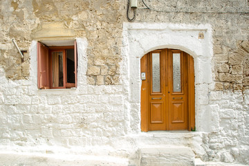 Wooden door and windows in old town of Rhodes, Greece.