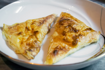 Burek with cheese.Balkanic pie on the plate.