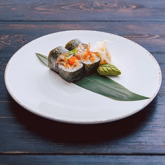 sushi on a black wooden surface