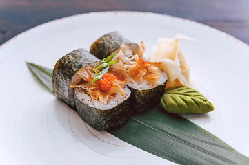 sushi on a black wooden surface