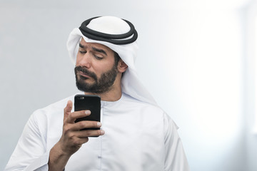 Arabian Businessman expressing disappointment on the phone..