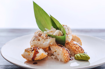 sushi on a black wooden surface