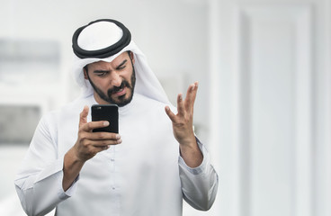 Arabian Businessman expressing anger on the phone..