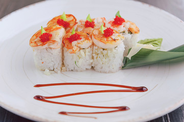 sushi on a black wooden surface