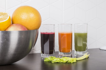 juicing fresh beautiful bright vegetables and fruits