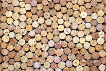 Background of used wine corks. Wall of many different wine corks. Closeup of wine corks.