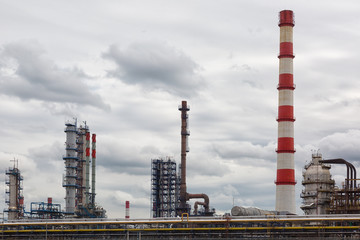 Chemical plant of a factory. Smokestacks ,pipes and tank