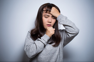 Woman has head ache on isolated background