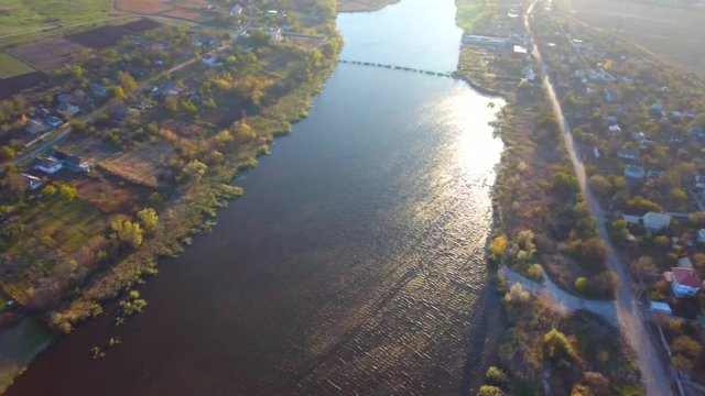 Aerial shot. Shining waves on the river. Ukraine. 4K, Ultra HD video.
