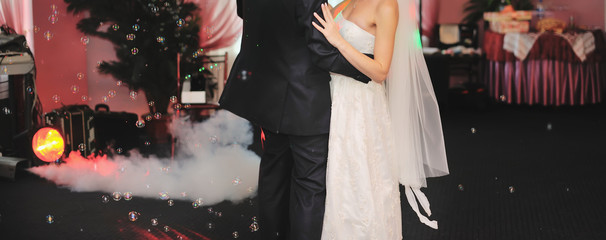young wedding couple dancing in the restaurant