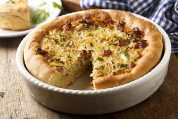 Onion pie with ham and wine