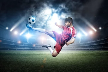 Rolgordijnen Football player's kicking in the stadium © efks