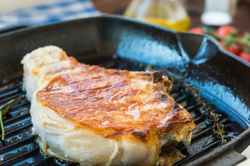 Frying rustic meat with spice for picnic