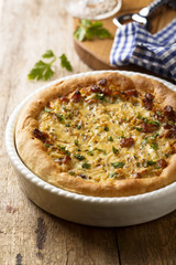 Onion pie with ham and wine