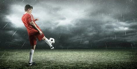 Foto op Plexiglas Football player is kicking a ball © efks