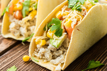 Homemade delicious tacos with chicken and vegetables