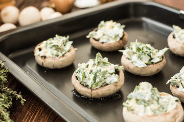 Raw mushrooms stuffed with spinach and cheese