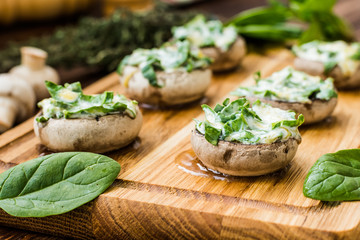 Cooked mushrooms stuffed with spinach and cheese