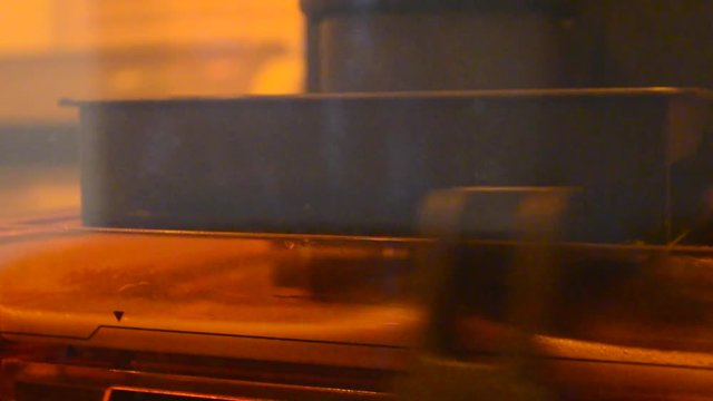 Print 3D printer detail of photopolymer general view, close. Stereolithography 3D printer, modern and progressive additive manufacturing technology of liquid photopolymerization under UV light