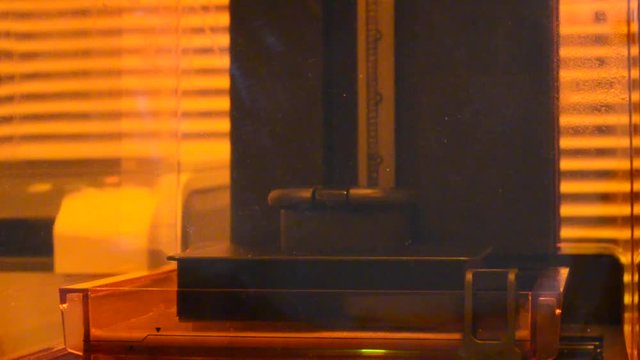 Print 3D printer detail of photopolymer general view, close. Stereolithography 3D printer, modern and progressive additive manufacturing technology of liquid photopolymerization under UV light
