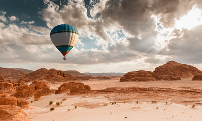 Fototapeta na wymiar Hot Air Balloon travel over desert