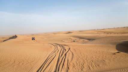 Fototapeta na wymiar Dubai, UAE - May 30, 2013 - Desert safari on jeeps near Dubai. UAE