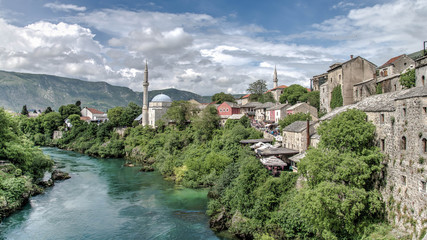 Fototapeta premium Mostar, Bosnia Herzegovina - May 1, 2014: Nerteva River and Old City of Mostar, with Ottoman Mosque