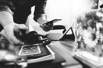 Man using VOIP headset with digital tablet computer docking keyb