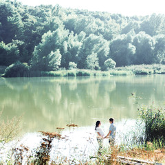 Look from afar at lovely couple holding each other hands while t