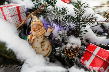 Fototapeta na wymiar Beautiful fir tree decorated with Christmas gift box