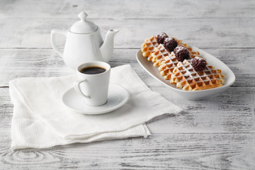 Brussels waffles with blackberries on plate