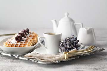 Brussels waffles with blackberries on white plate